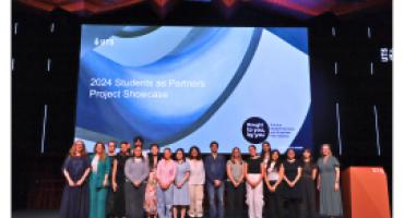 Students on stage at the 2024 Students as Partners Showcase