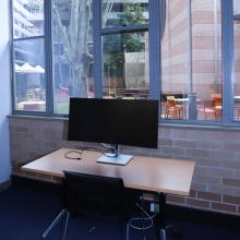 New wide-screen monitors in a private online learning room