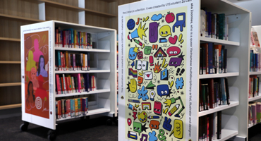 Bookshelves with student artwork on the ends