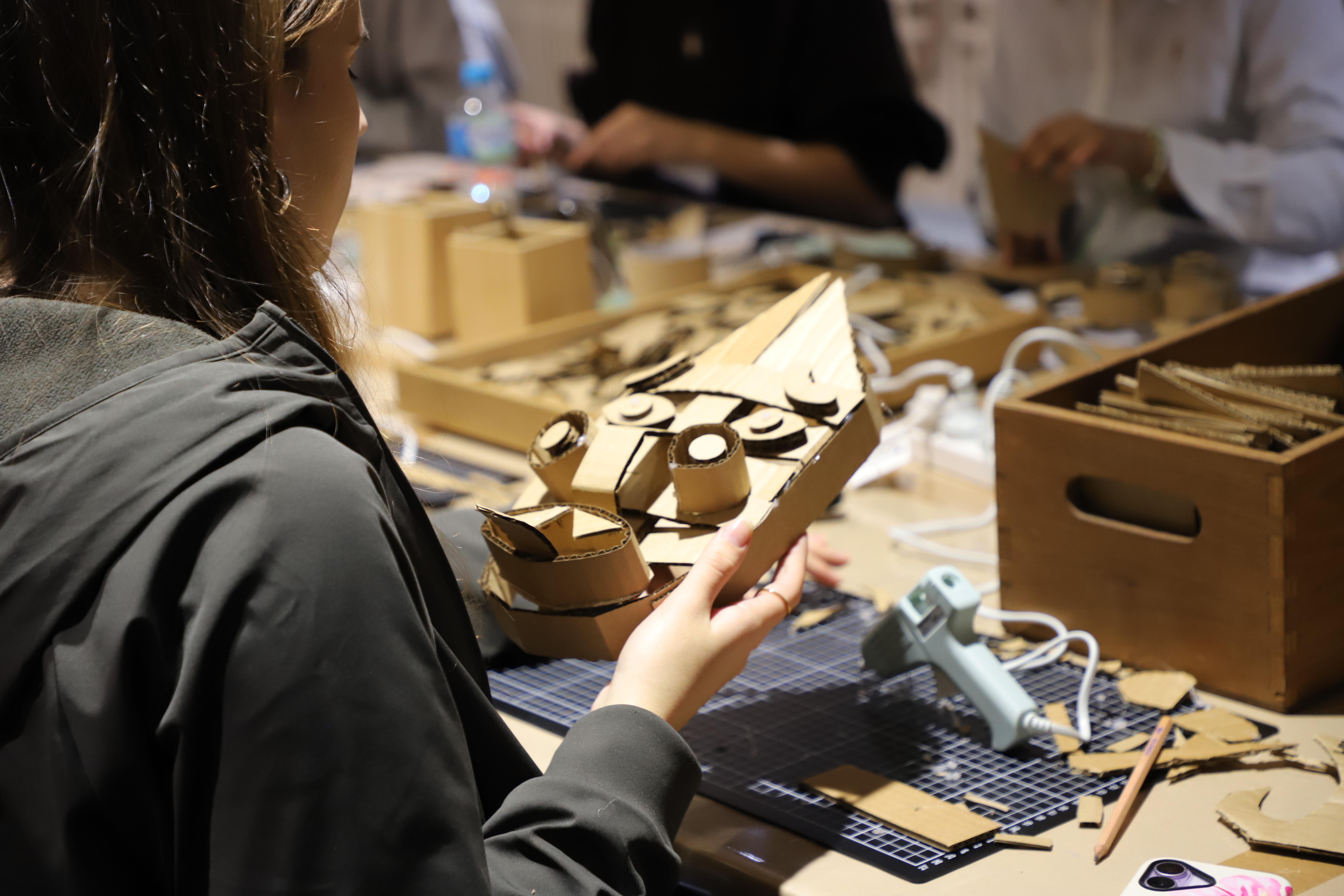 Photo student making a cardboard mask activity