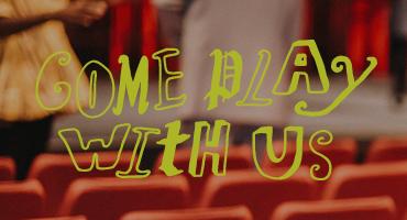 text "Come play with us" on photograph of a theatre 