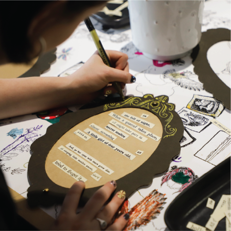 Close up photo of person doing craft activity 