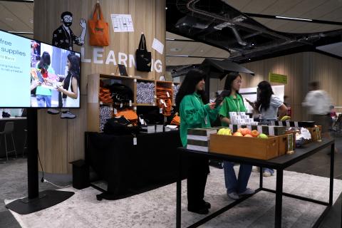 Student Guides handing out free study supplies packs to students