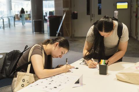 Student doing the bee origami activity 