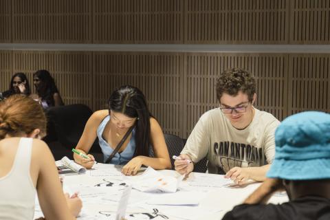 Student doing the bee origami activity 