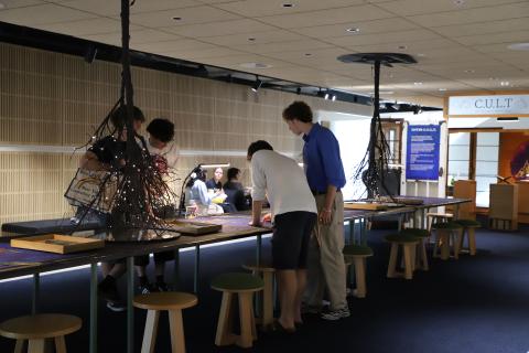 A group of boys making a collage
