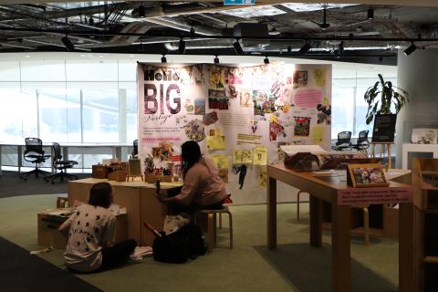 People making collages for the Big Vertigo wall