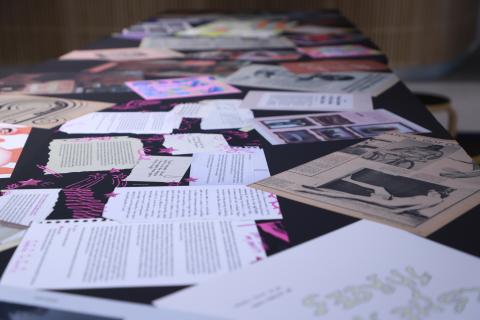 Scattered Vertigo Magazine spreads across a table