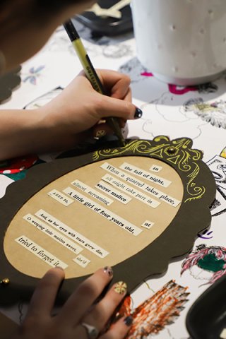 Photo close up of hands doing craft activity 