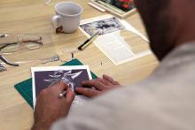 Over the shoulder shot of a person collaging